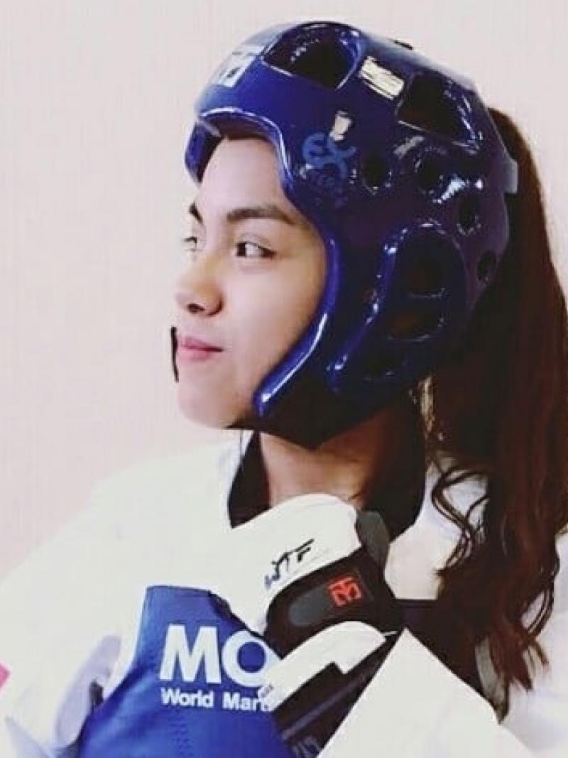 female Para taekwondo fighter Claudia Romero turns her head to the side