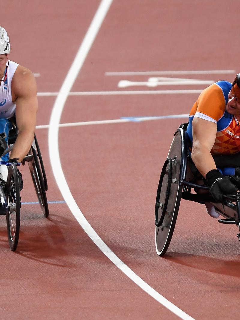 two male wheelchair racers, Leo Pekka Tahti and Kenny van Weeghel, line up on the start line