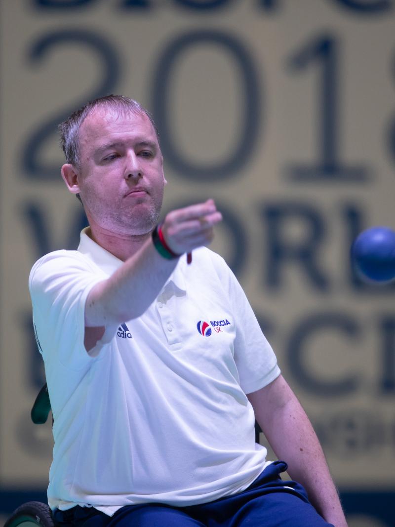 male boccia player Stephen McGuire takes a shot