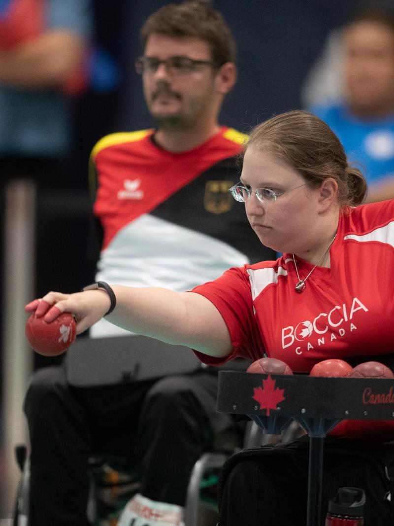 female boccia player Alison Levine takes a shot