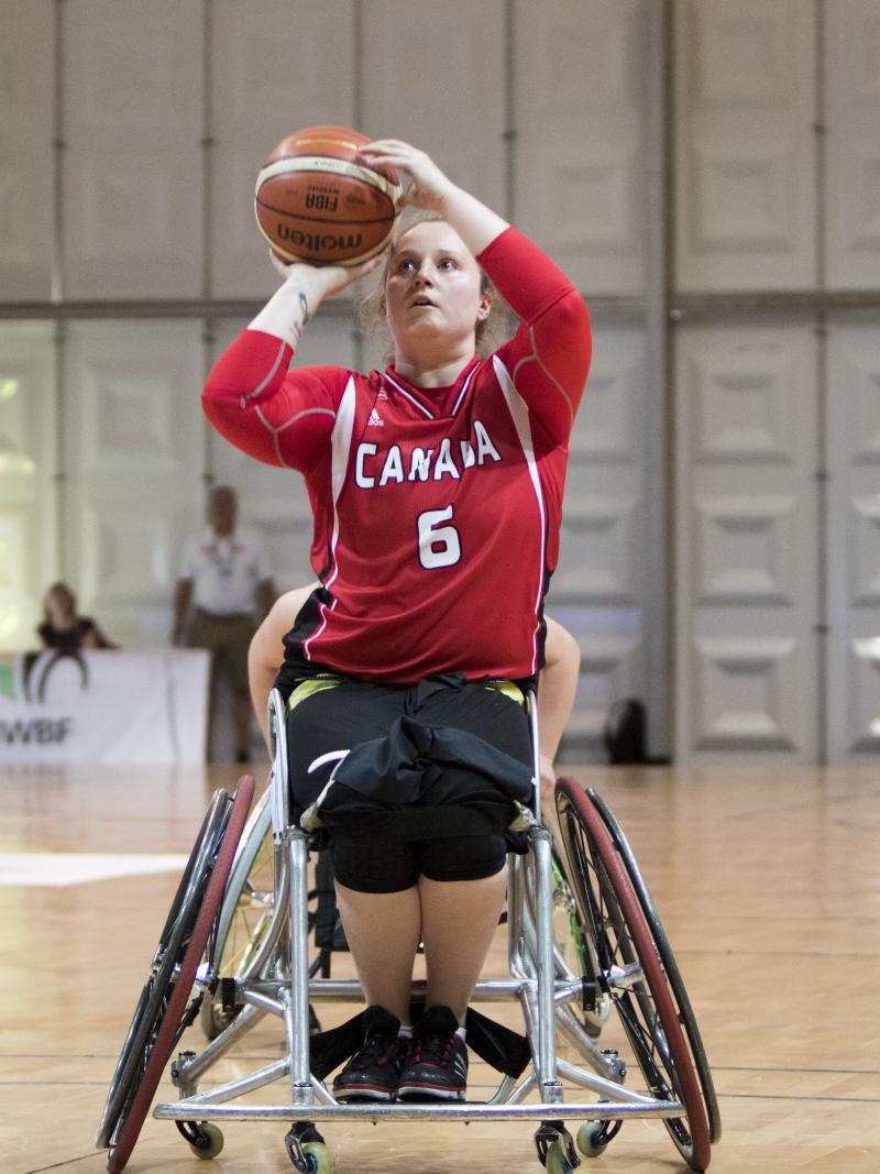 female wheelchair basketballer Arinn Young prepares to take a shot
