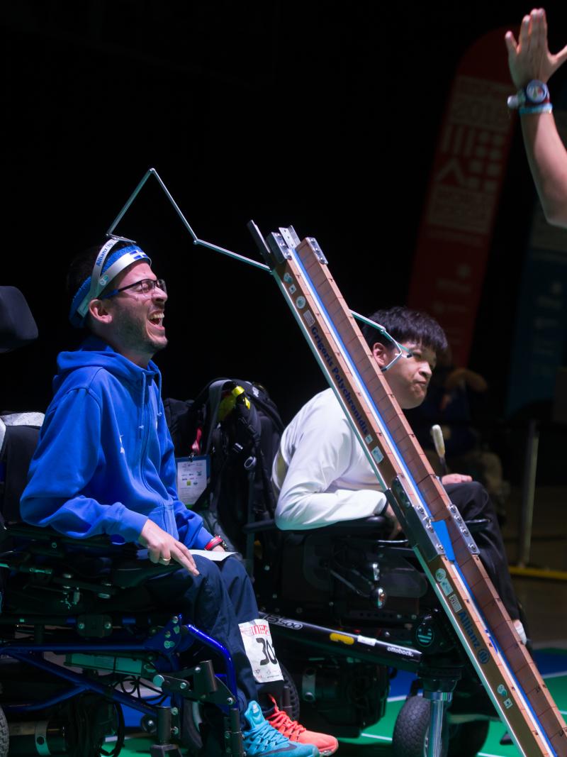 male boccia player Greg Polychronidis celebrates his winning ball