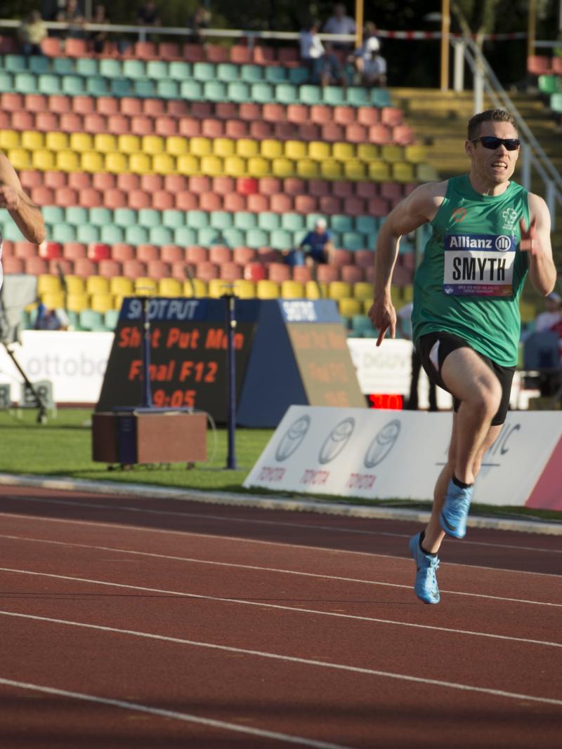 male vision impaired sprinter Jason Smyth runs towards the finish line