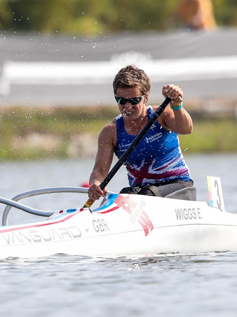 female Para canoeist Emma Wiggs performing a stroke