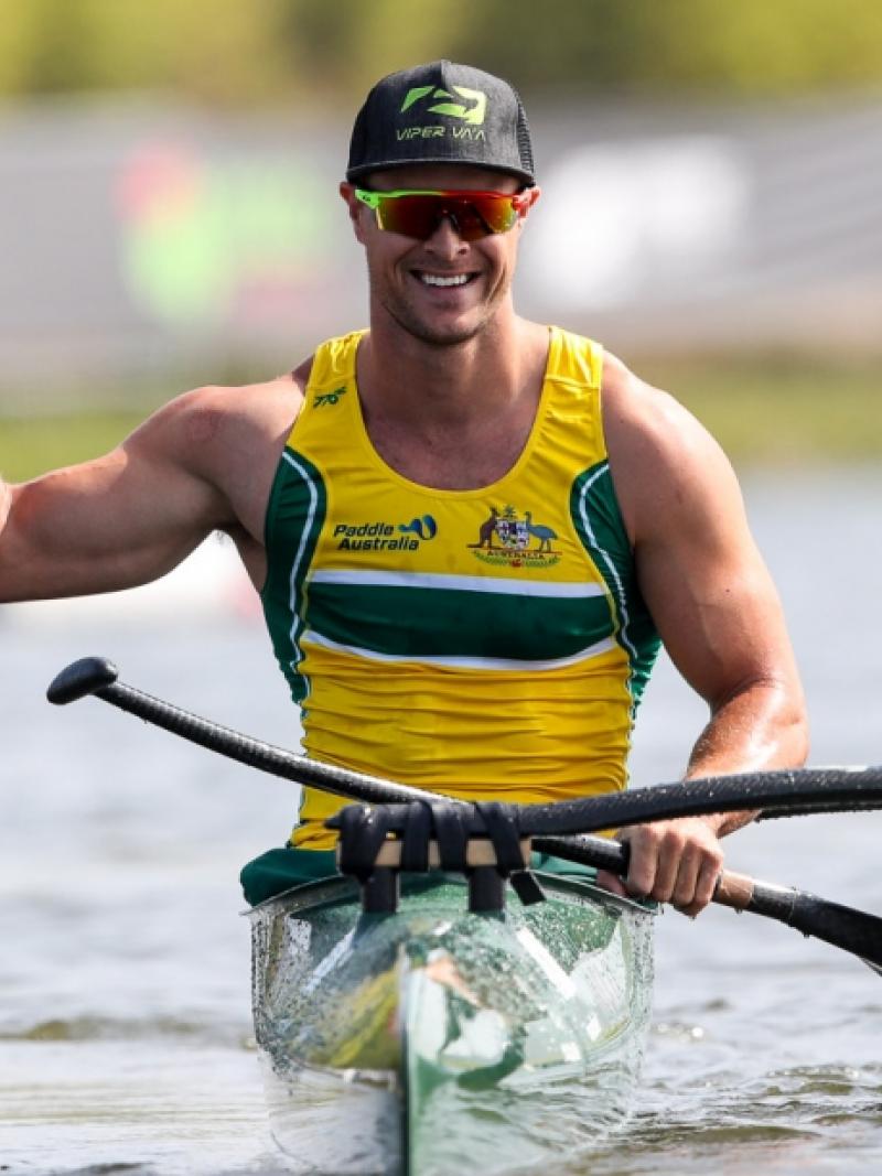 Man in a canoe celebrating