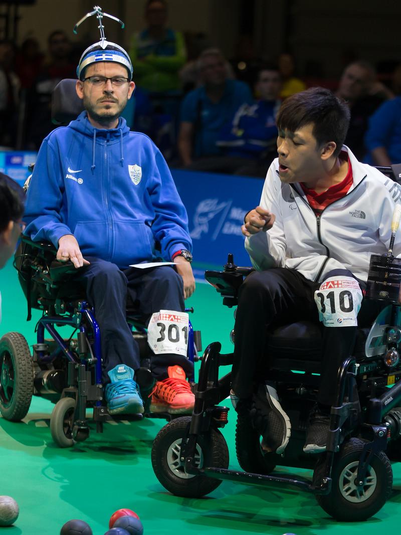 male boccia players Greg Polychronidis and Howon Jeong prepare to play