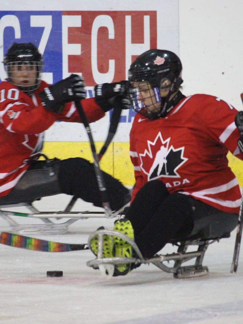 two female Canadian Para ice hockey players on the ice