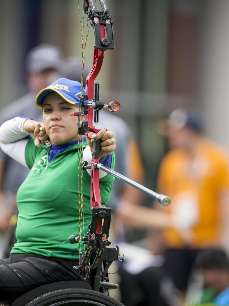 female Para archer Jane Gogel pulls back an arrow ready to shoot