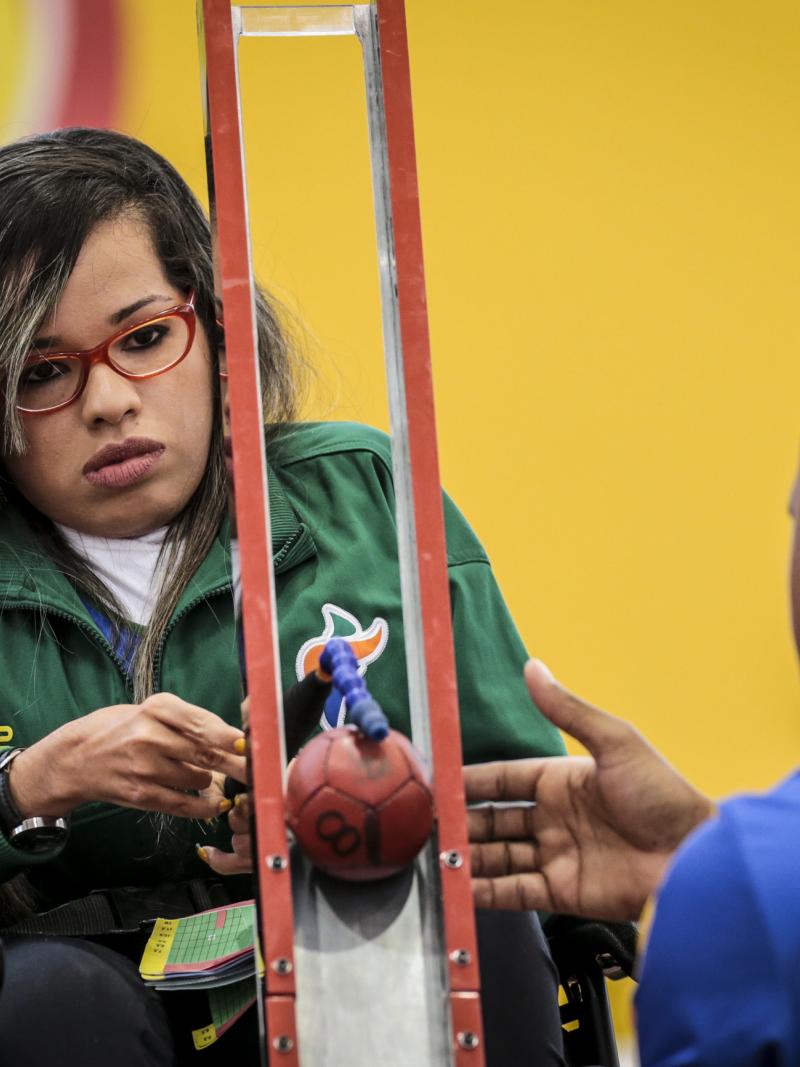 female boccia player Evelyn de Oliveira prepares to play a ball