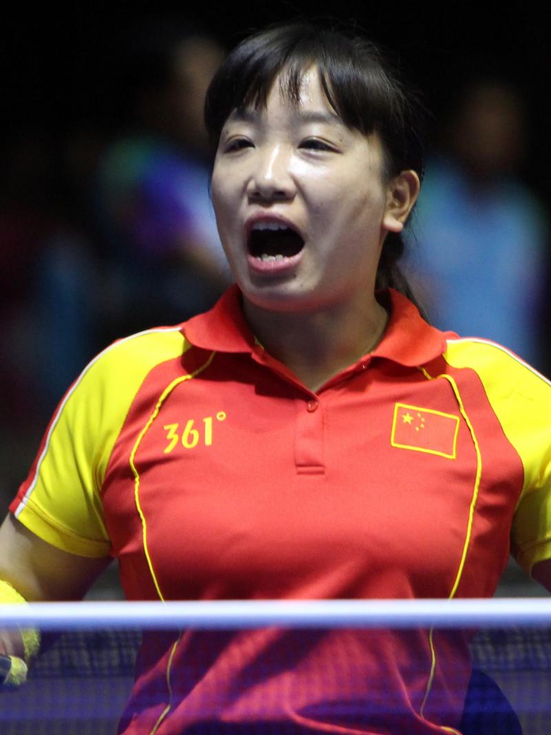 female Para table tennis player Xue Juan clenches her fist and shouts in celebration