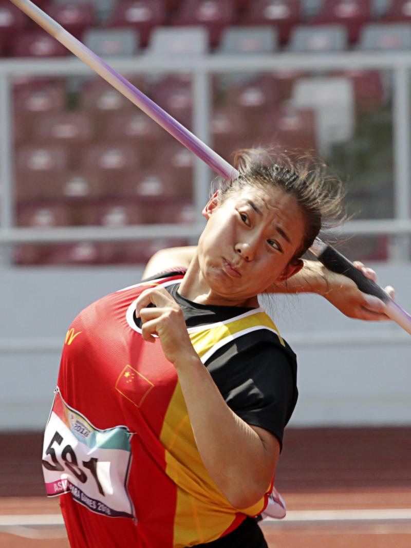 female Para athlete Zhao Yuping throws a javelin