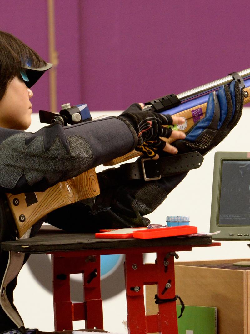 female Para shooter Cuiping Zhang looks at her target screen