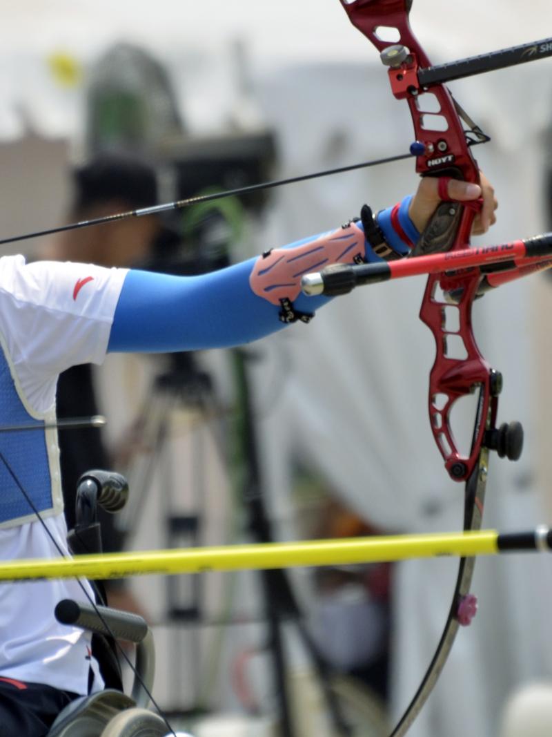 female Para archer Wu Chunyan draws back her bow to shoot an arrow
