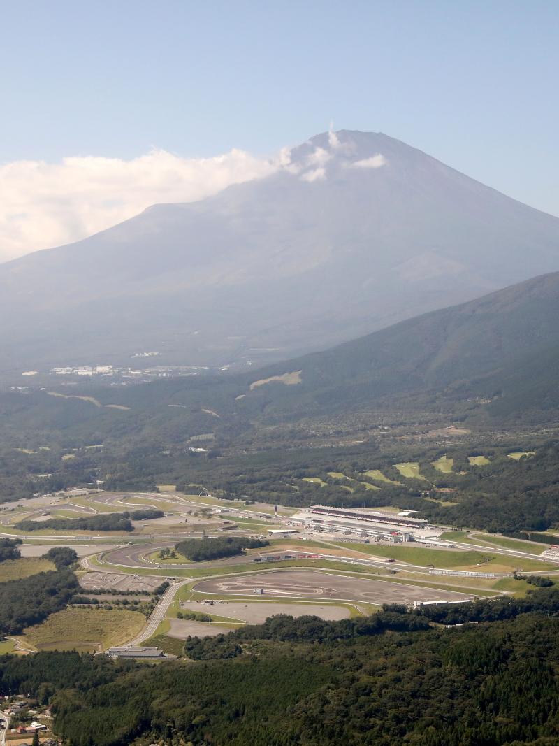 Motor racing circuit with a mountain in the background