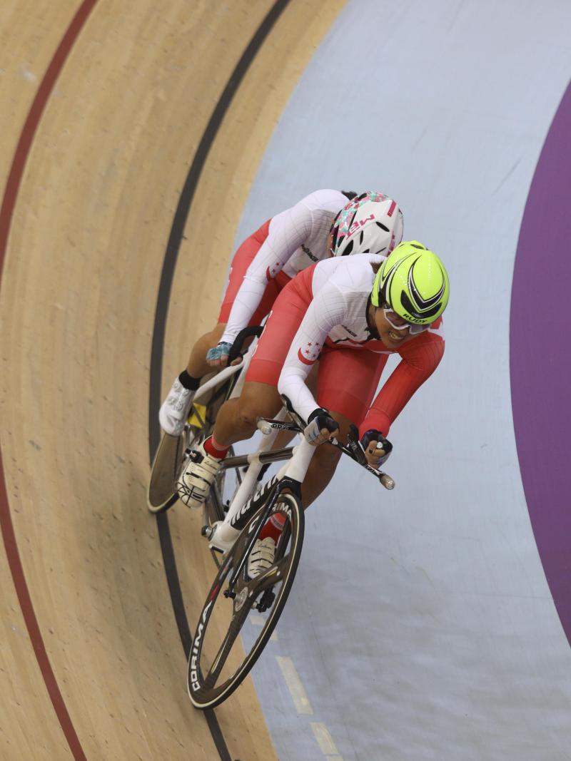 female Para cyclist Emily Lee goes round the track on a tandem cycle