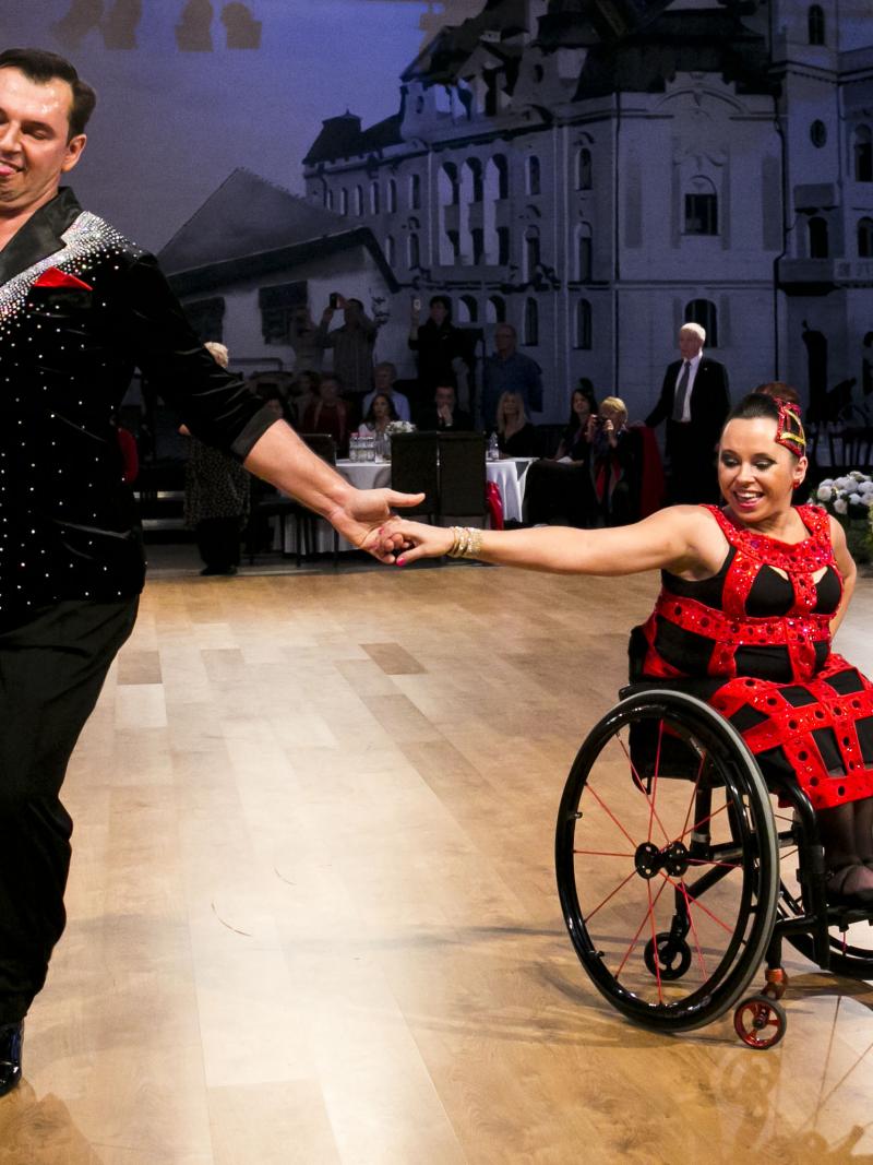 female Para dancer Helena Kasicka holding hands with her male partner during a dance
