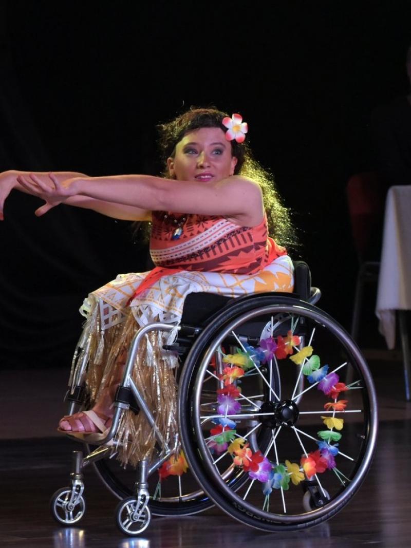 female Para dancer Julia Sadkowska stretches out her arms during a dance move