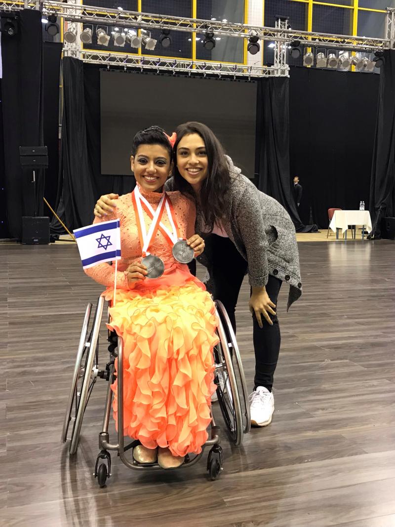female Para dancer Tomer Margalit hugging her twin