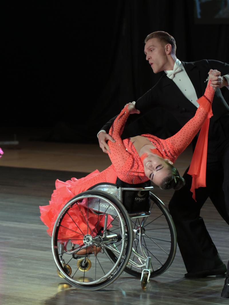 Para dancers Hanna Harchakova and Roman Usmanov in a ballroom pose on the dance floor