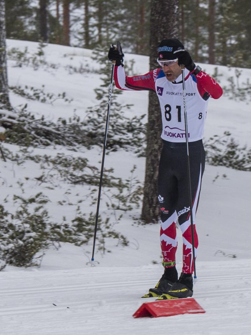 male Para Nordic skier Brian McKeever stands on skis 