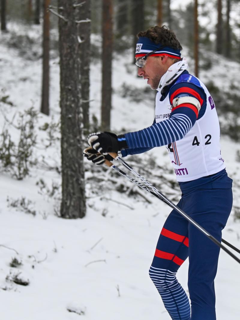 male Para Nordic skier Benjamin Daviet pushes through the snow