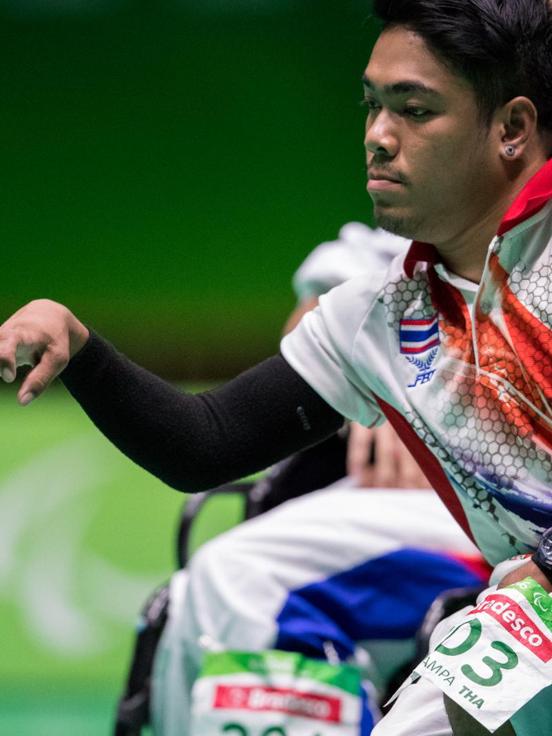 male boccia player Worawut Saengampa plays a ball