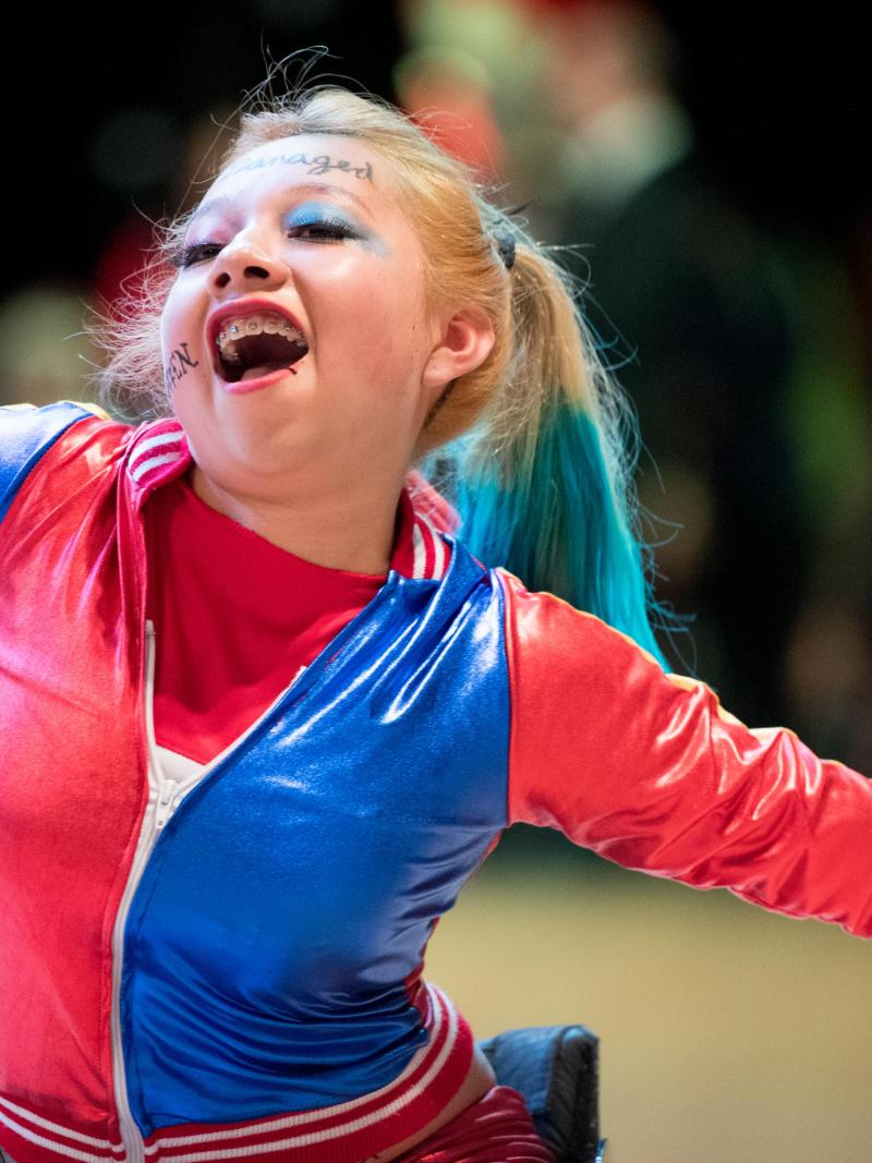 Young Mexican female athlete dances in her wheelchair