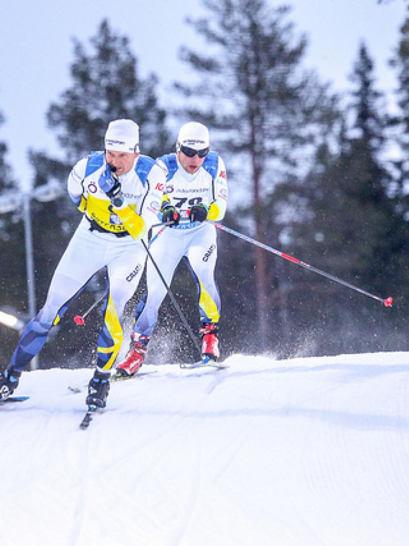 Swedish vision impaired skier follows behind his guide