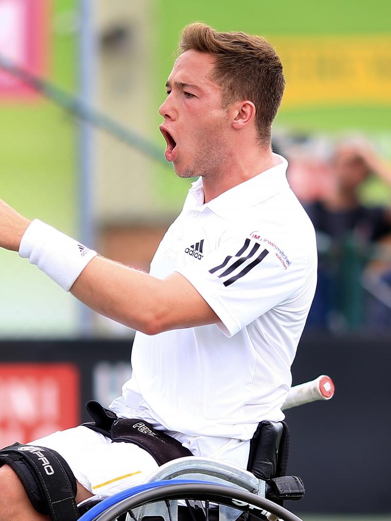 male wheelchair tennis player Alfie Hewett yells in triumph after winning a point