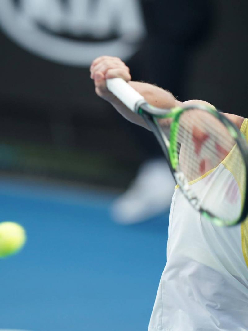 female wheelchair tennis player Diede de Groot plays a backhand on a hard court