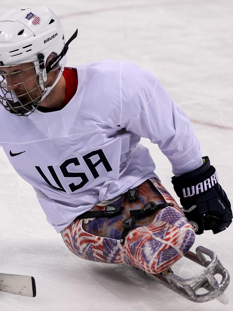 male Para ice hockey player Tyler Carron on the ice