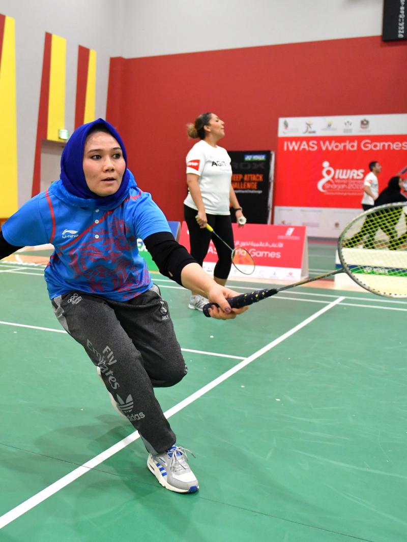 Female Para badminton player practices during workshop in UAE