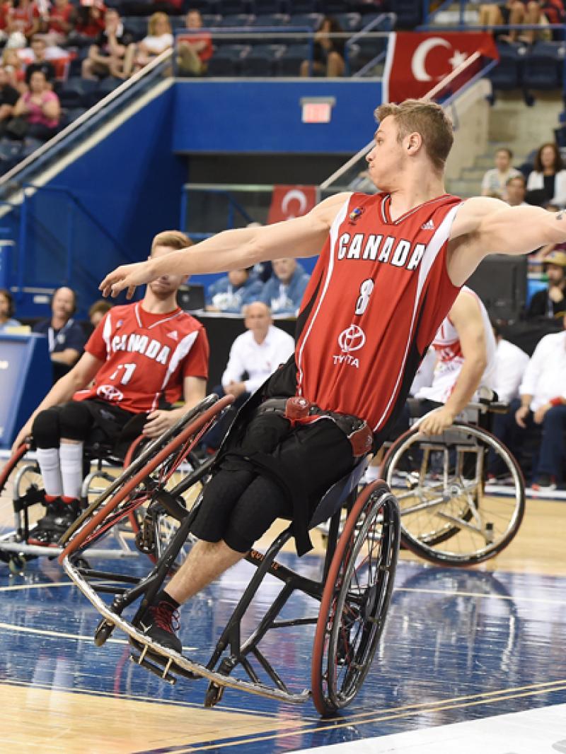 male wheelchair basketballer Liam Hickey tilts sideways as he prepares to throw the ball