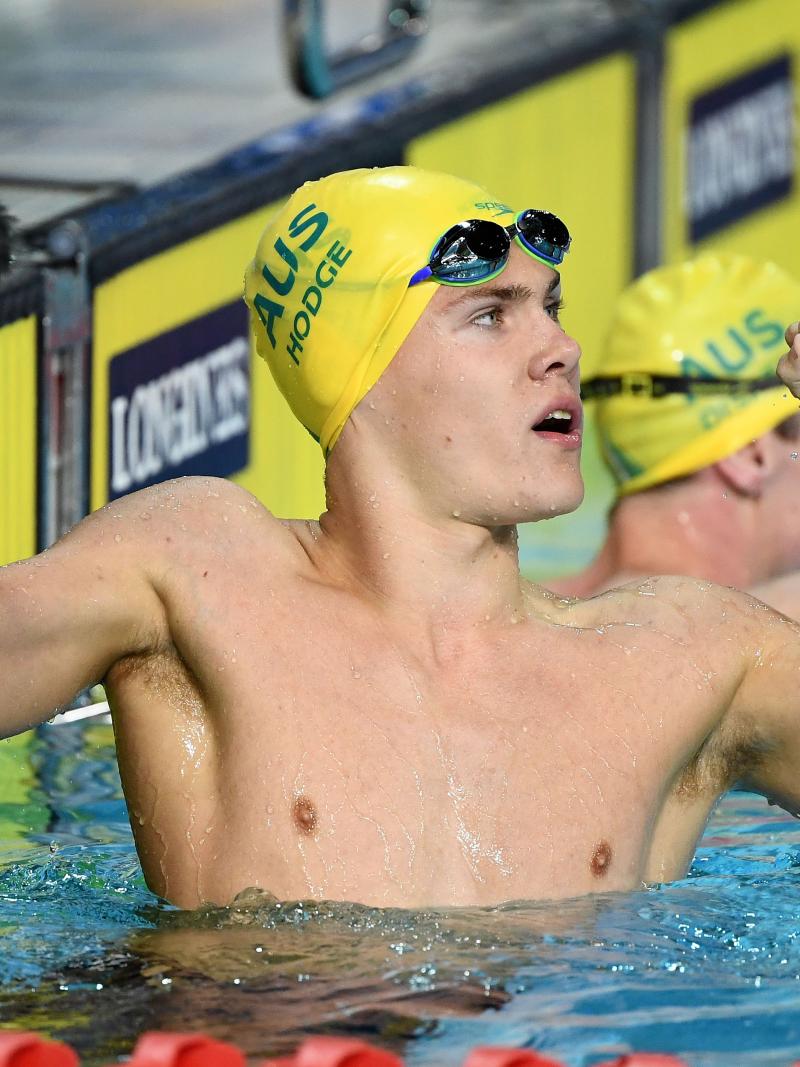 male Para swimmer Timothy Hodge fistpumps after winning a race