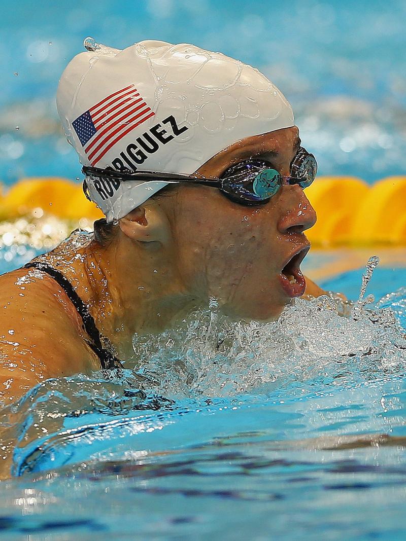 female Para swimmer Ileana Rodriguez takes a breath during a breaststroke