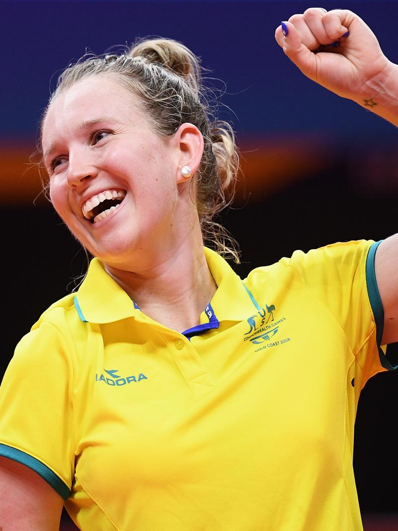 female Para table tennis player Melissa Tapper pumps her fist in victory