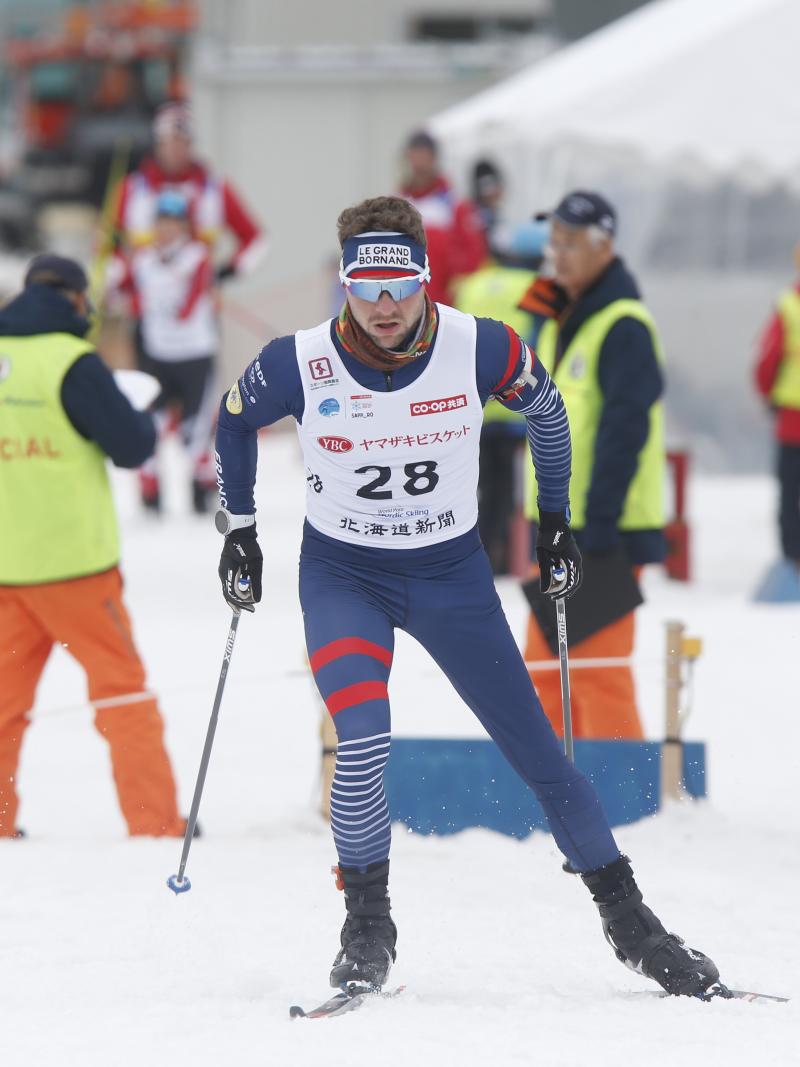 male Para Nordic skier Benjamin Daviet skis towards the finish line