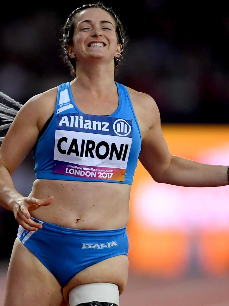 female Para sprinter Martina Caironi celebrates as she crosses the finish line
