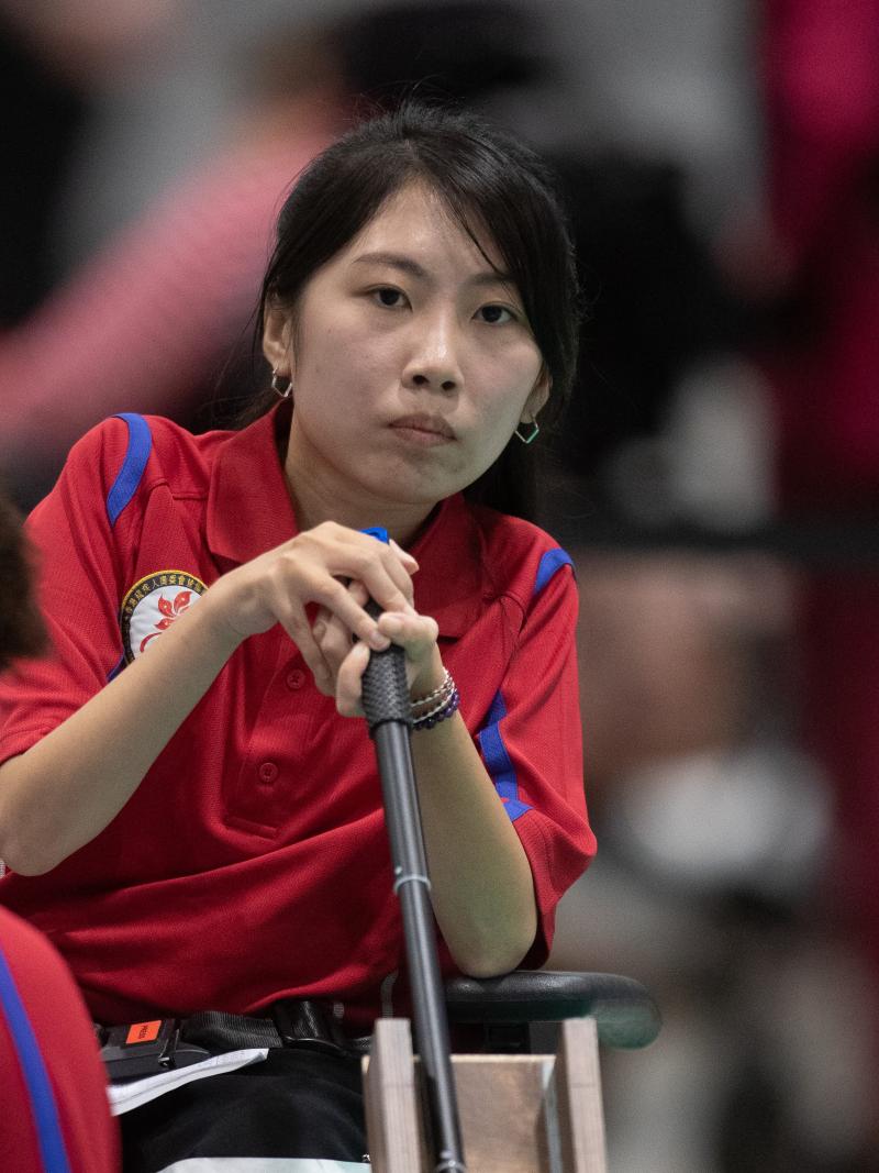 female boccia player Yuen Kei Ho watches a ball being played