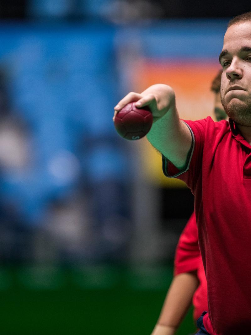 male boccia player Samuel Andrejcik throws a ball