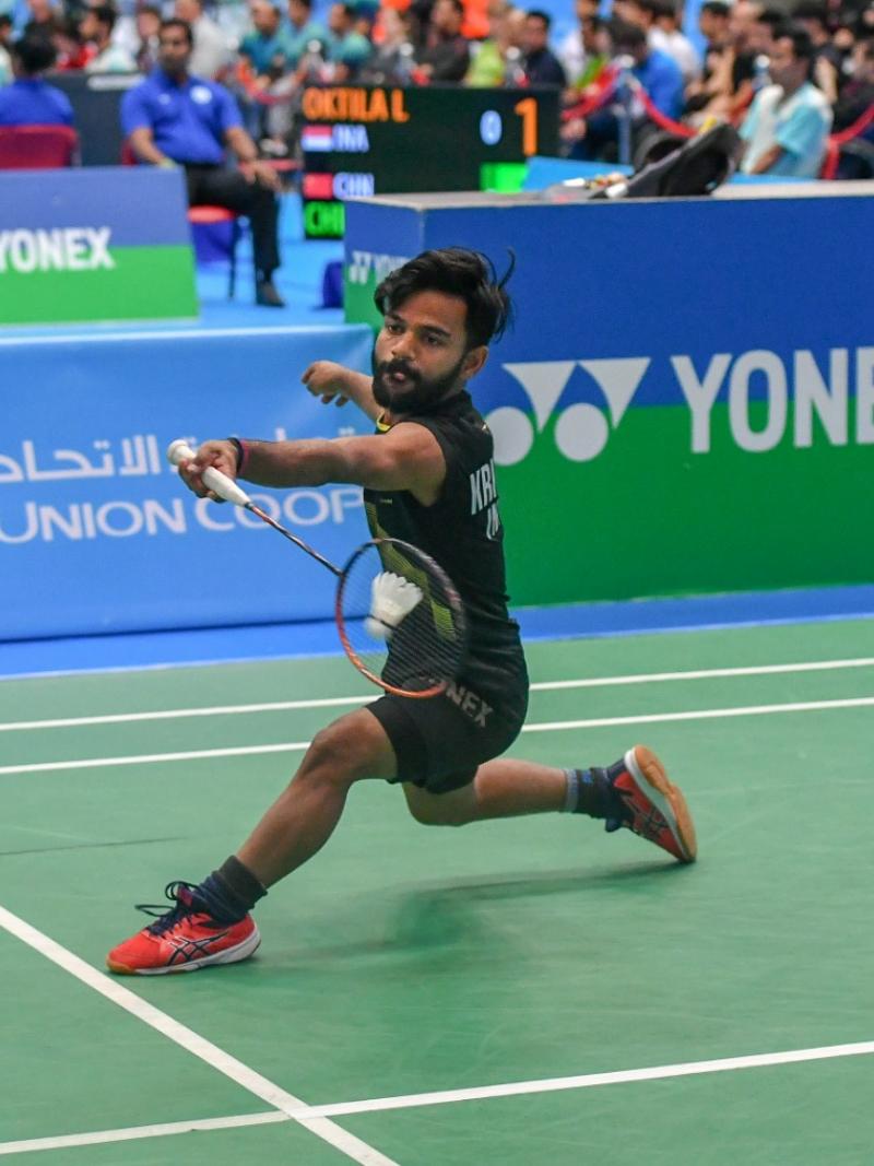 male Para badminton player Krishna Nagar plays a forehand