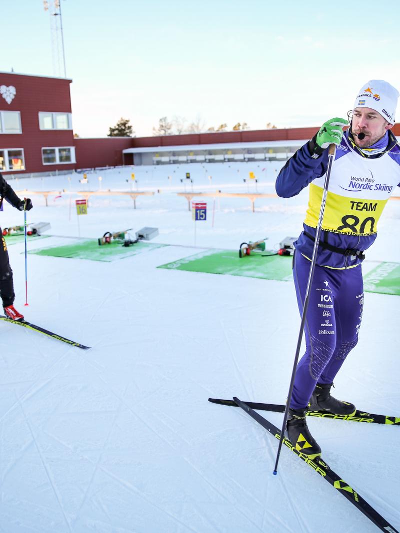 A blind Nordic skier following his guide