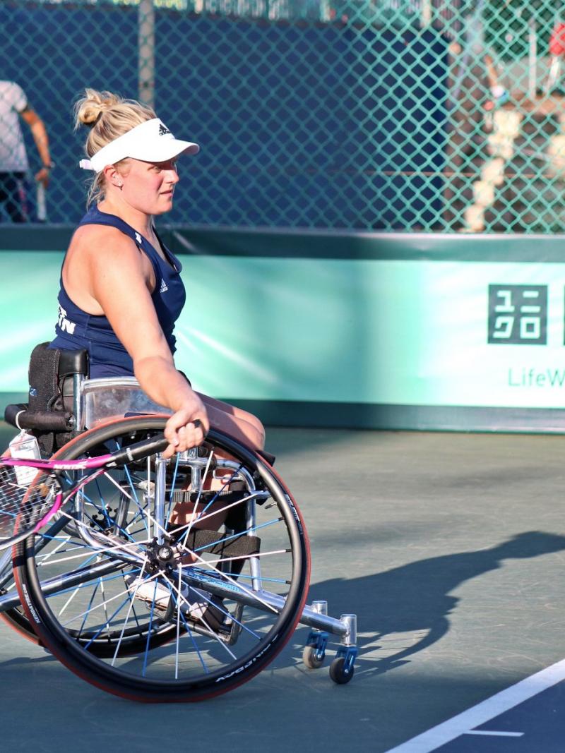 Wheelchair tennis player Jordanne Whiley about to hit the ball