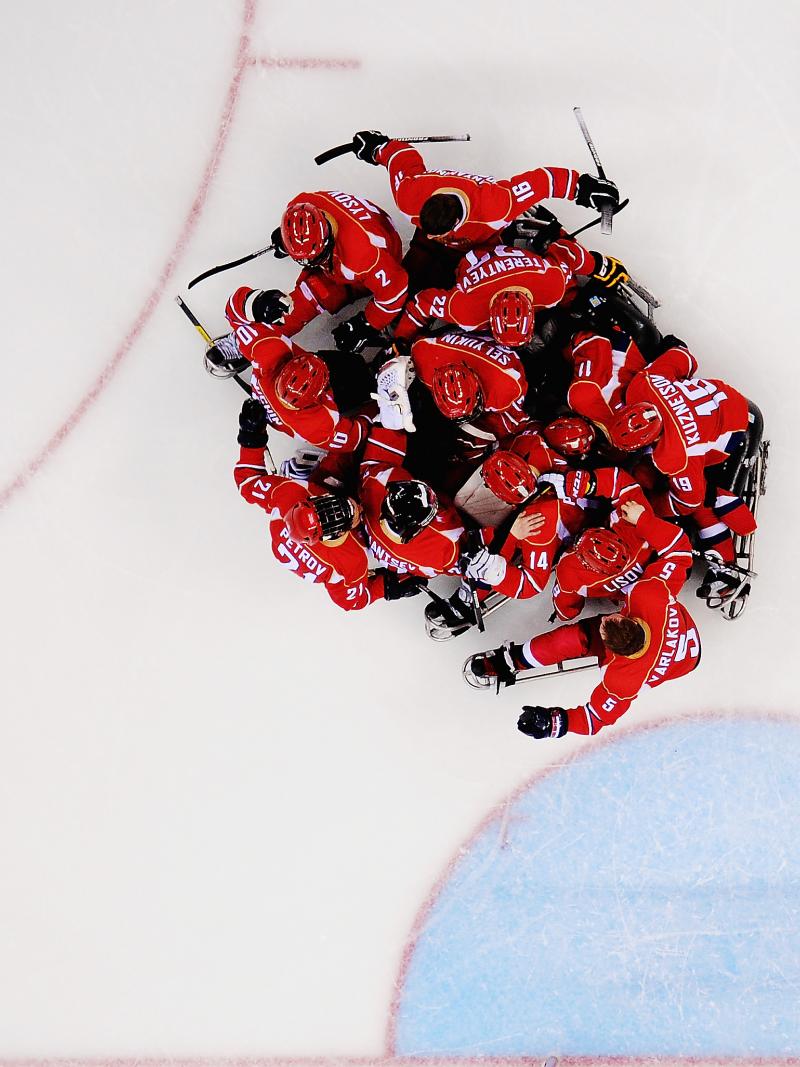 Russia's Para ice hockey players celebrating on ice