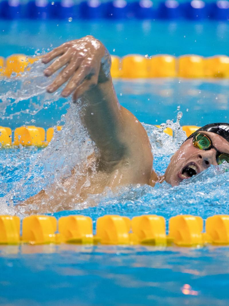 A man swimming in a pool
