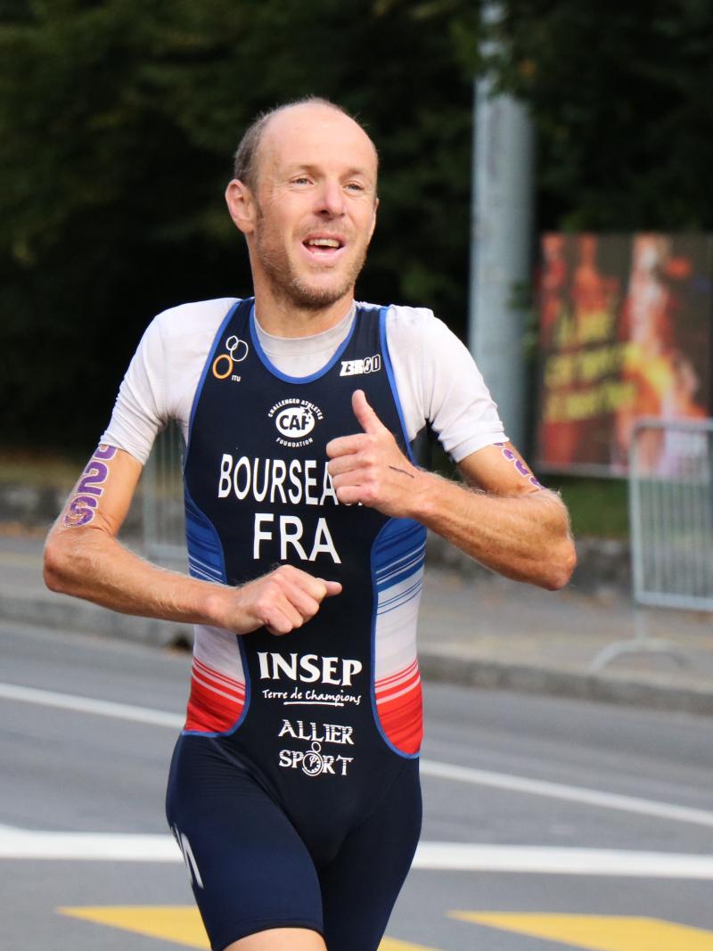 Yannick Bourseaux exhausted running to the finish line