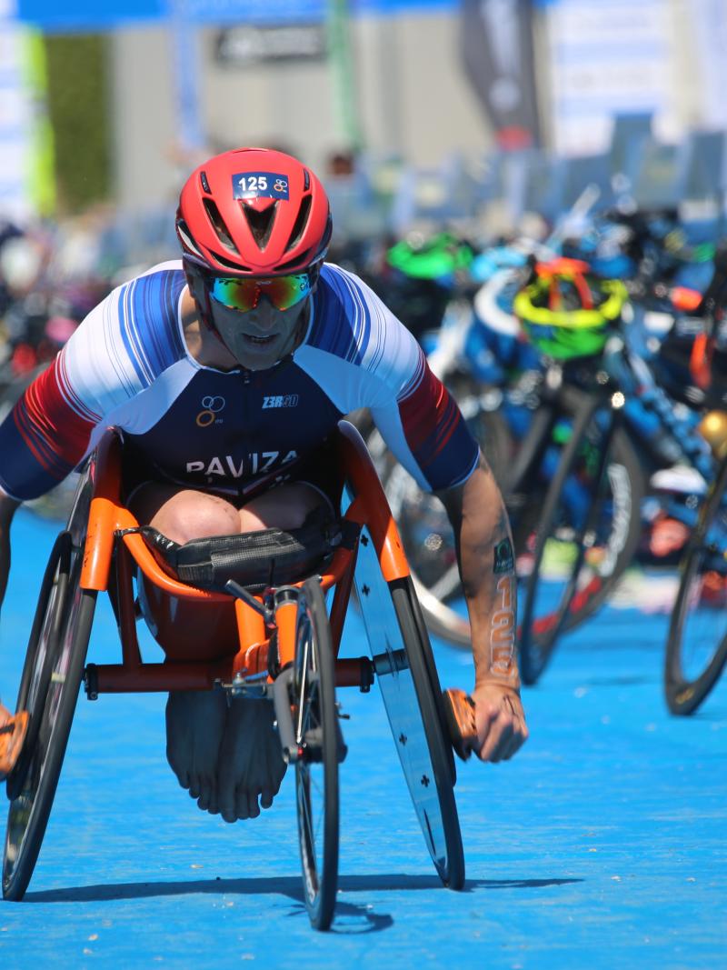 A male Para triathlete in a wheelchair race