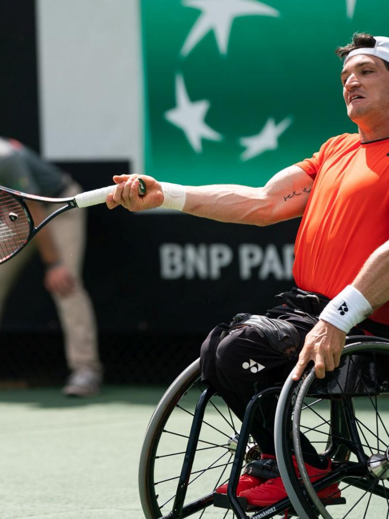 Argentinian wheelchair tennis player Gustavo Fernandez hits a forehand