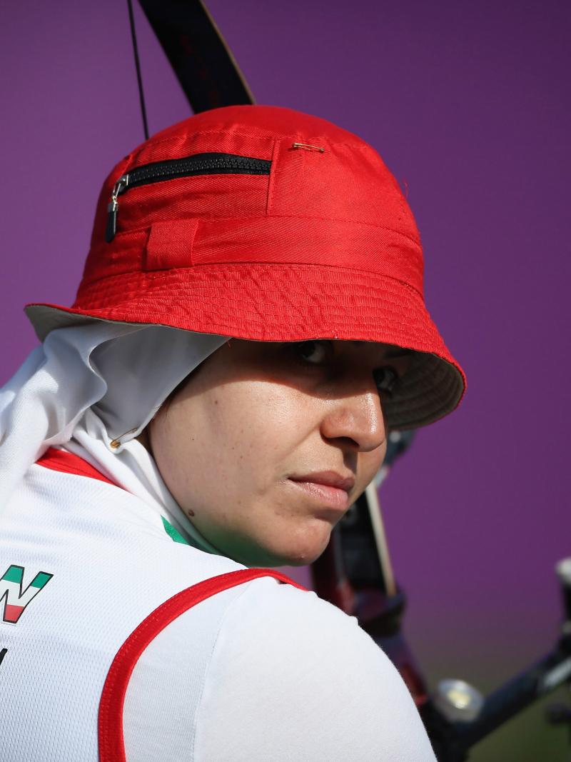 A female archer with a red hat
