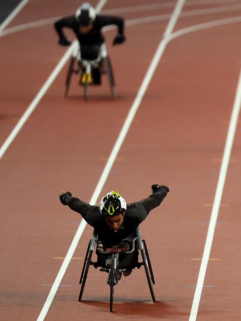 A wheelchair racer ahead of three competitors